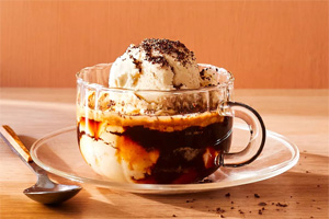 Cup of vanilla gelato in expresso and topped with expresso grounds