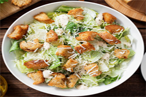 Tradition caesar salad with romain lettuce, crispy croutons, and mozzarella