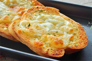 Chrisp bread topped with melted mozzarella cheese