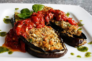 Eggplant stuffed with cheese and breadcrumbs topped with chuncky tomato marinara