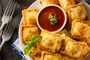 Ravioli fried to perfection served with a side of marinara